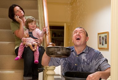 Family trying to stop water leak