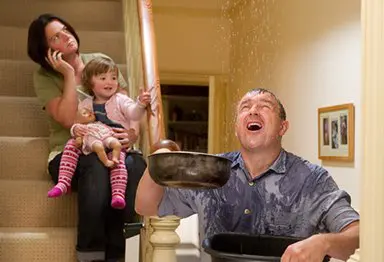 Family trying to stop water leak